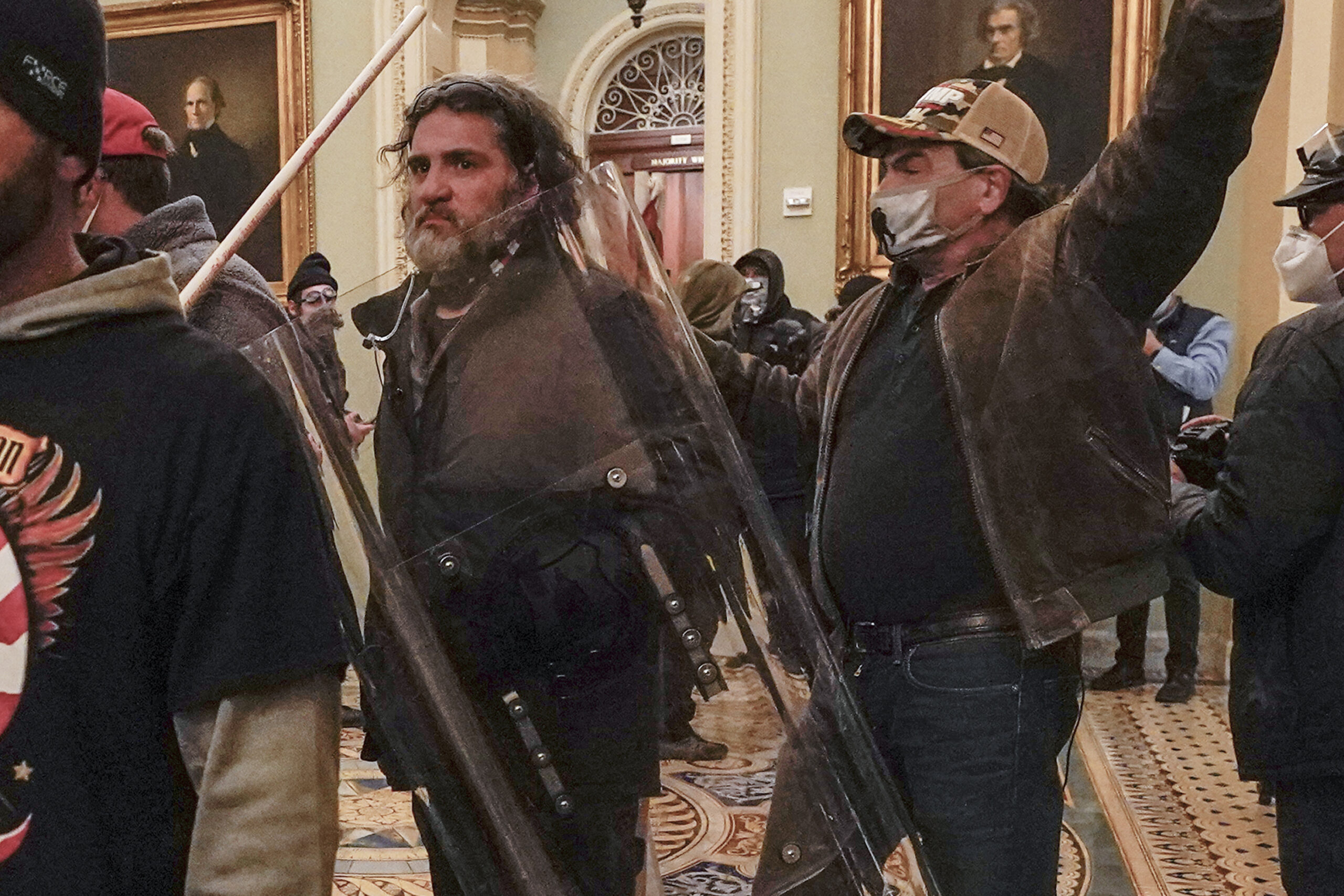 FILE - Rioters, including Dominic Pezzola, center with police shield, are confronted by U.S. Capito...