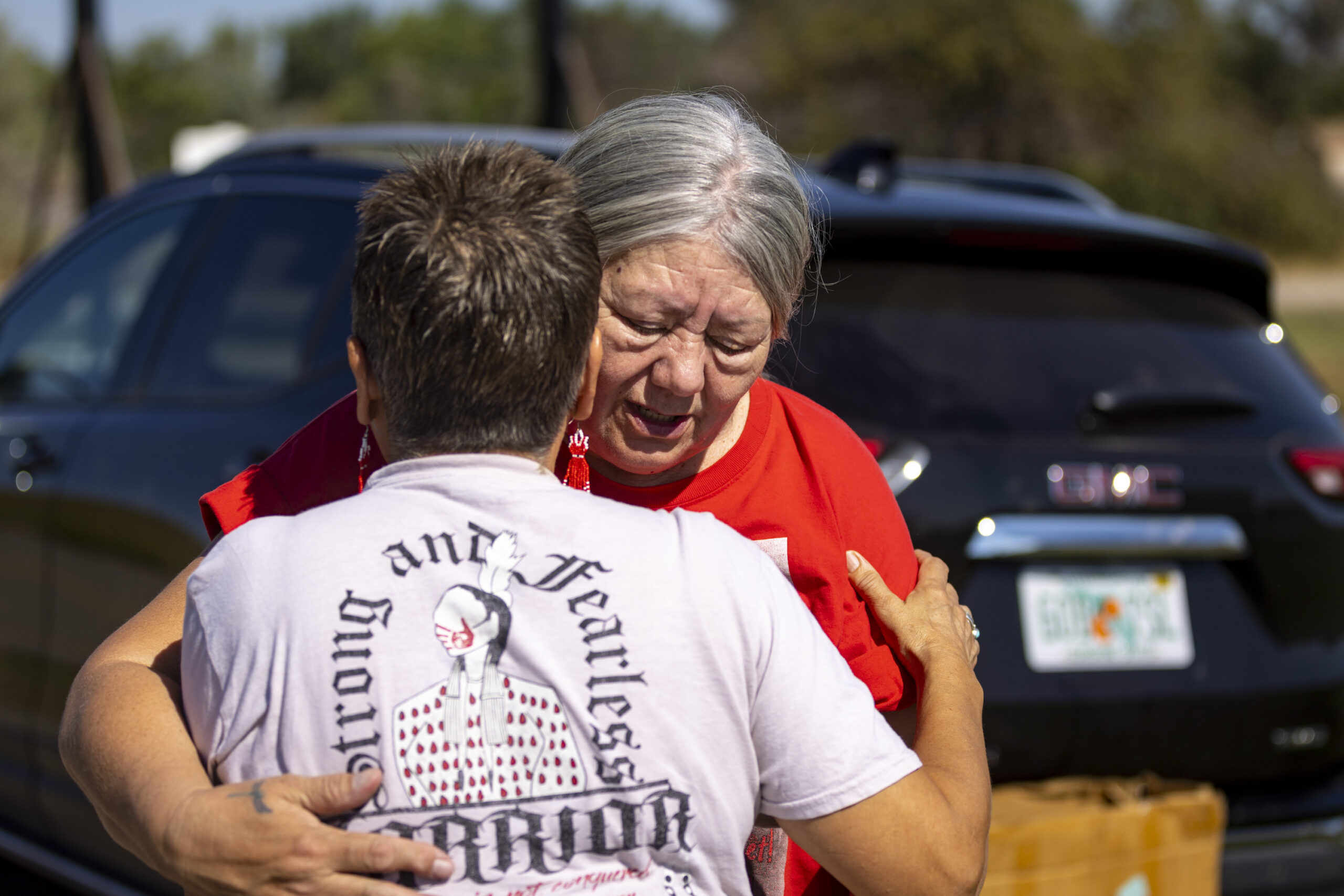 Yolanda Fraser, Kaysera Stops Pretty Places' grandmother, gets a hug before a dedication ceremony f...