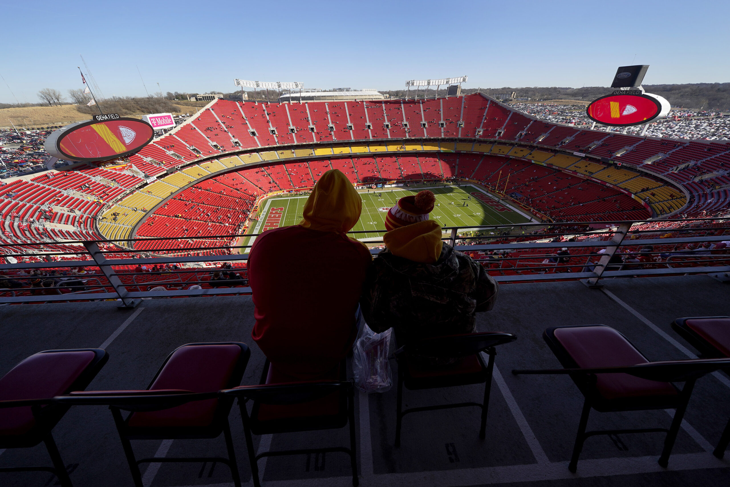 FILE - Fans sit inside Arrowhead Stadium, home of the Kansas City Chiefs, before an NFL football ga...