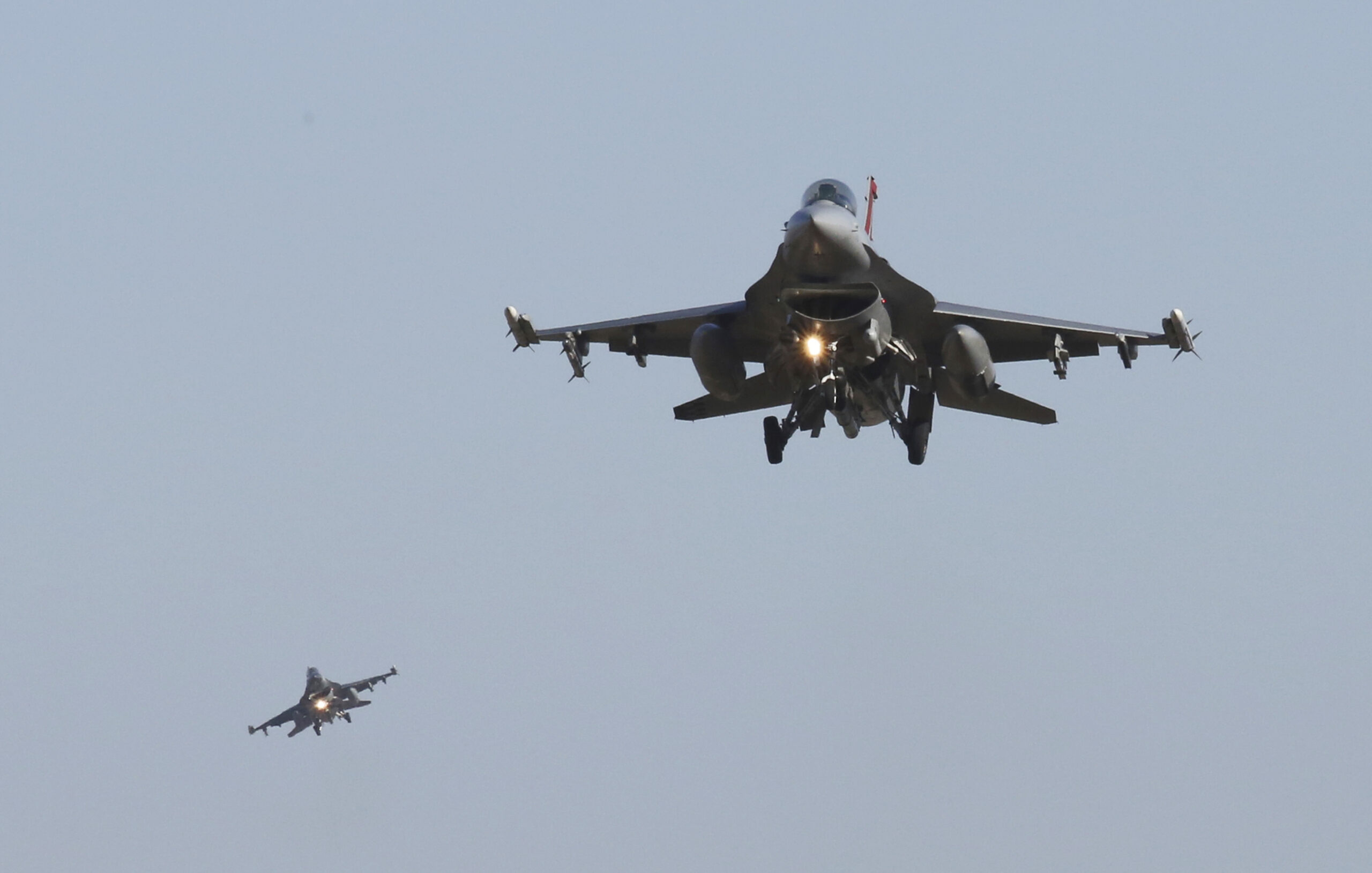 FILE - U.S. Air Force F-16 fighter jets fly over the Osan U.S. Air Base during a combined air force...