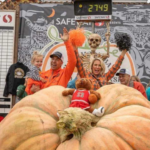 Image: Travis Gienger and his family stand with the largest pumpkin ever recorded. It weighed 2,749 pounds. 