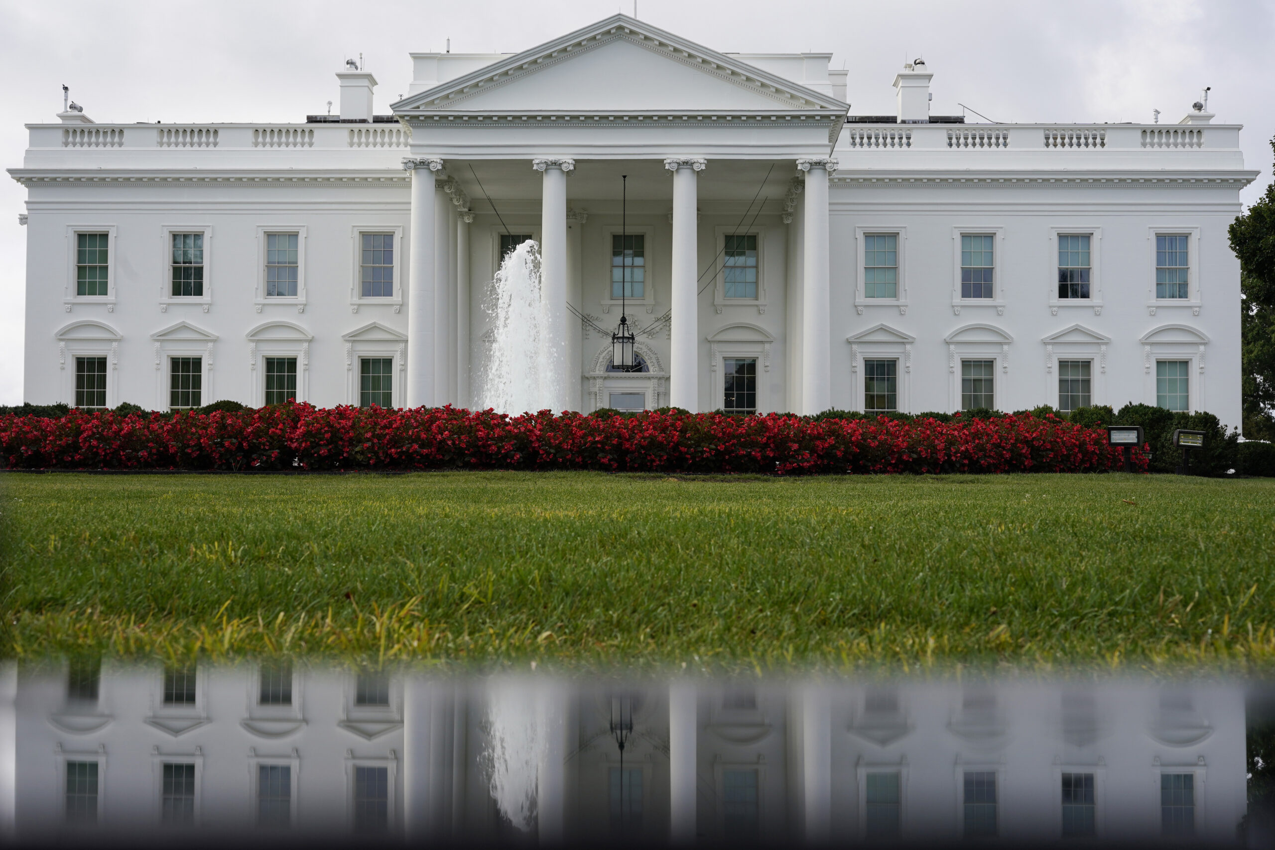 FILE - The White House is seen reflected in a puddle, Saturday, Sept. 3, 2022, in Washington. In a ...