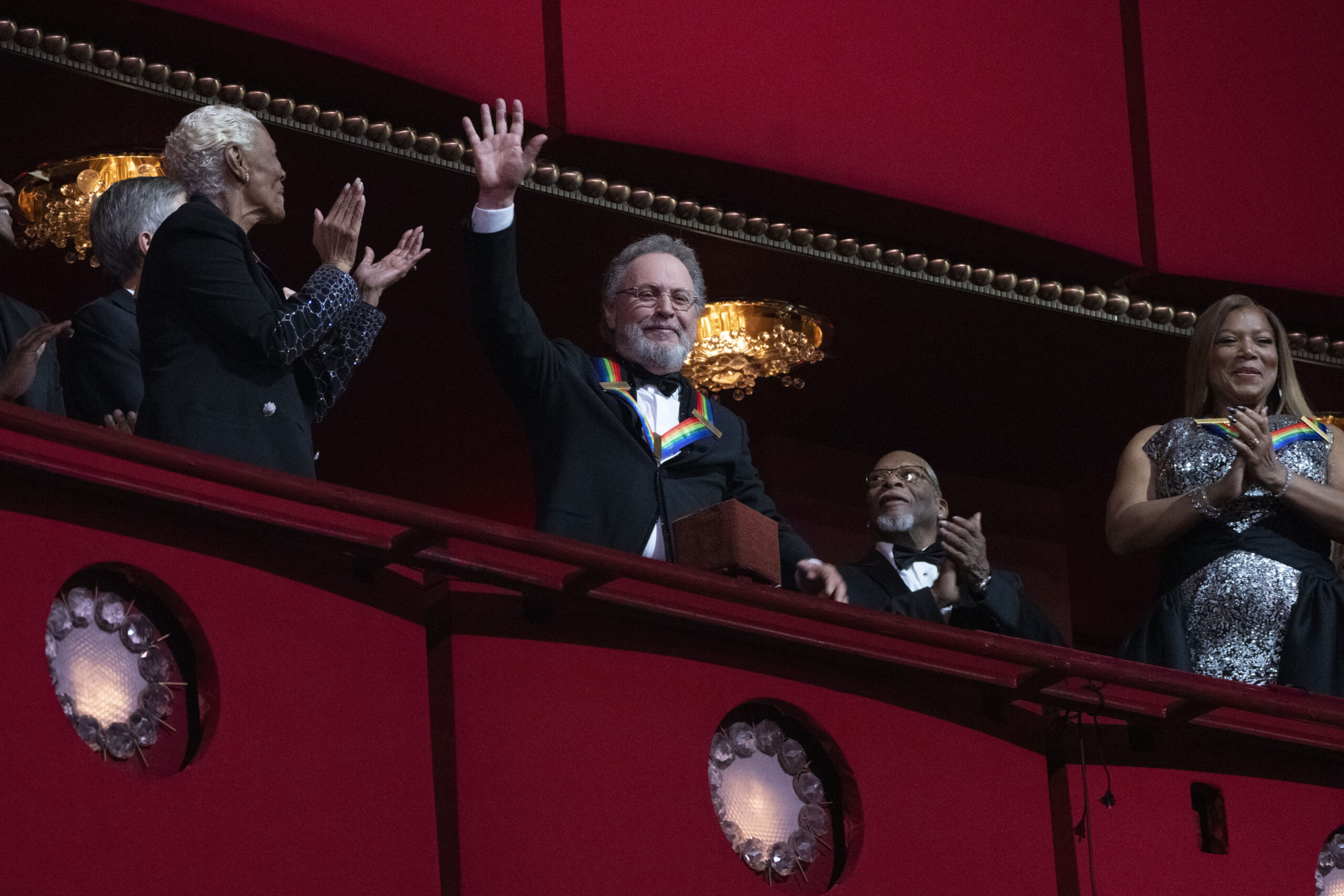 2023 Kennedy Center Honoree, comedian Billy Crystal, center, waves as he is applauded by fellow hon...