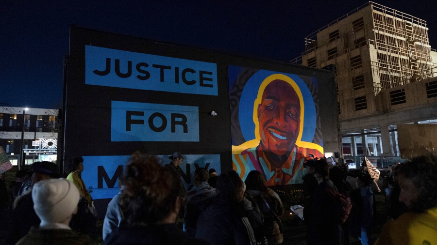 Image: Protesters gather at a rally after the verdict was read at the trial of three Tacoma police ...