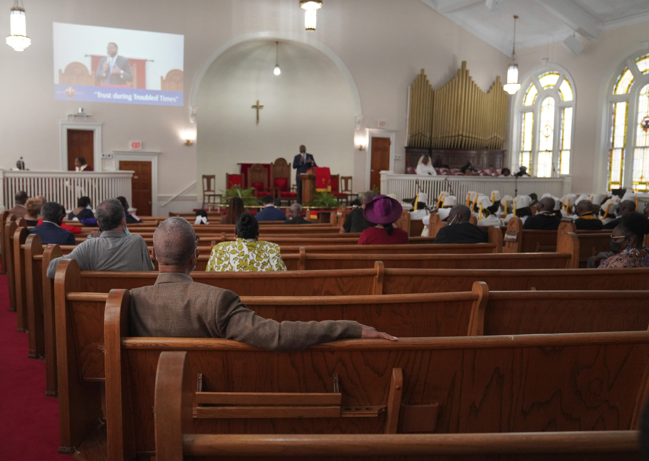 FILE - Congregants sit in largely empty pews during service at Zion Baptist Church, April 16, 2023,...