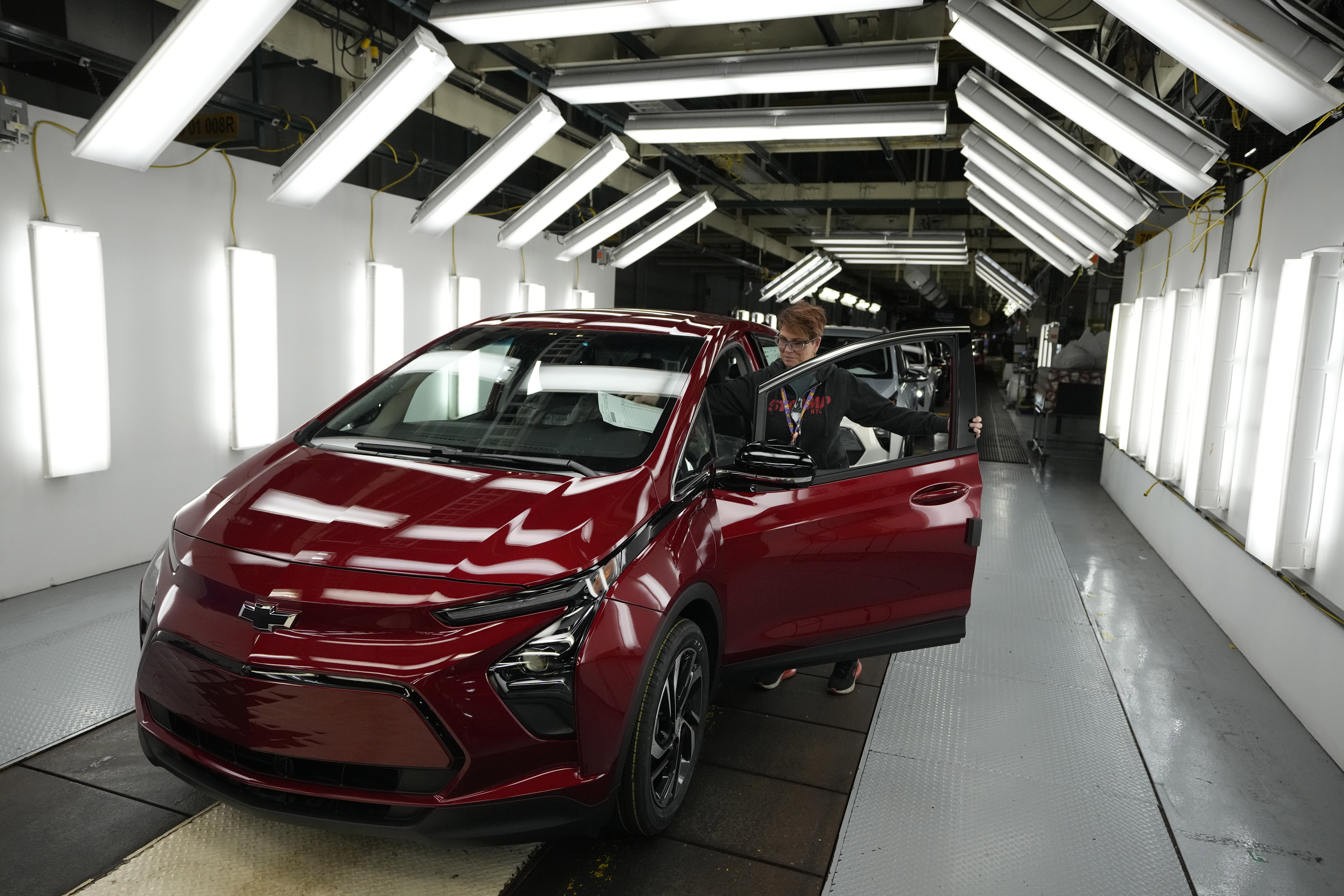 File - Assembly line worker Janice DeBono looks over a 2023 Chevrolet Bolt EUV at the General Motor...