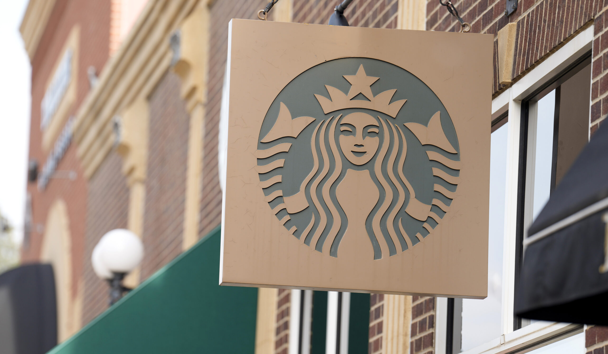 Starbucks sign. (AP Photo/David Zalubowski)...
