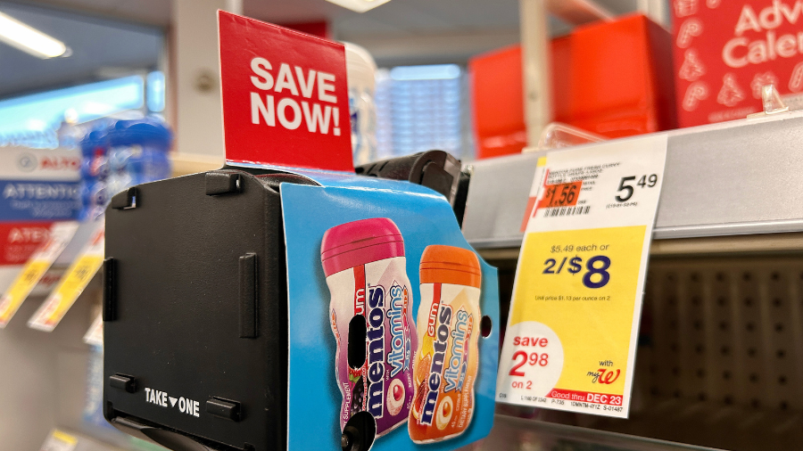 Image: A dispenser at a Walgreens store dispenses coupons for Mentos vitamins....