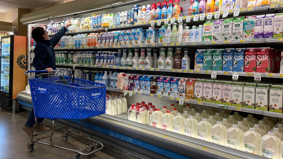 A customer shops for milk at a grocery store in San Anselmo, California, on Dec. 12, 2023. (Photo: ...