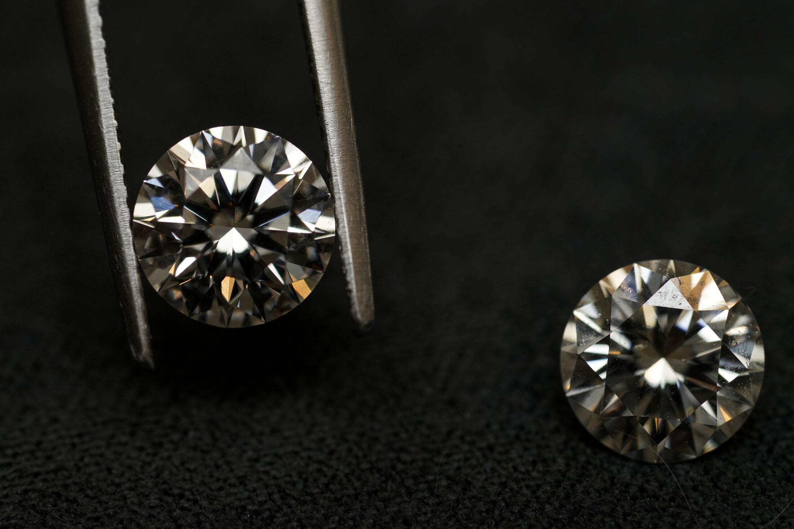 A lab grown diamond, left, and a natural diamond are displayed at Bario Neal, a jewelry store, in P...