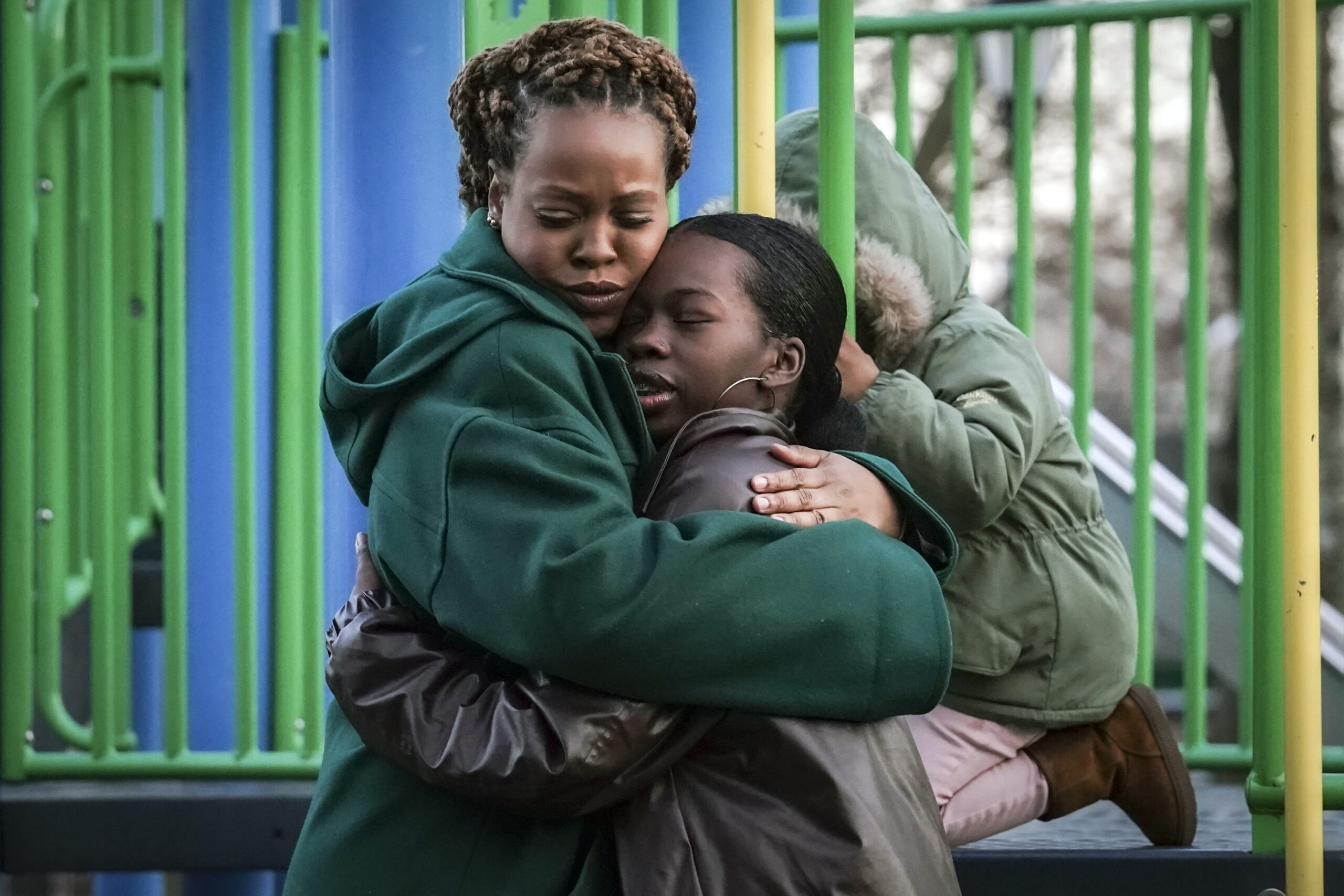 Derry Oliver, 17, right, hugs her mother, also Derry Oliver, during a visit to a playground near ho...