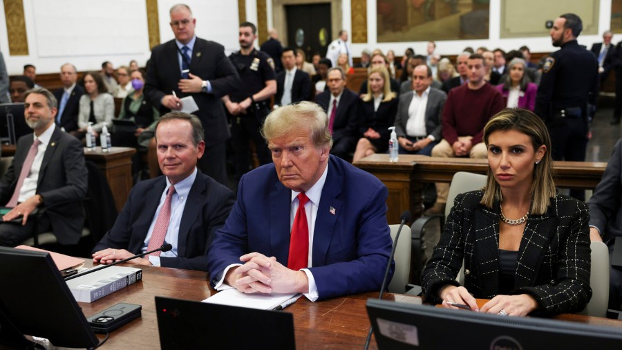 Image: Former President Donald Trump, with lawyers Christopher Kise and Alina Habba, attends the cl...