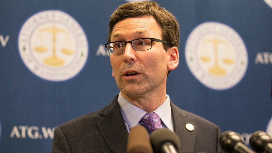 Image: Washington Attorney General Bob Ferguson speaks during a press conference at his office on F...