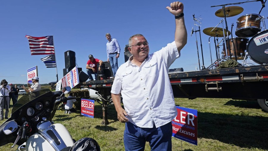Image: Then-Republican gubernatorial candidate Loren Culp smiles while greeting supporters as he ar...