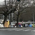 Image: A Seattle homeless encampment is seen on a city street.