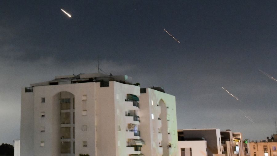 Photo: Israeli Iron Dome air defense system launches to intercept missiles fired from Iran, in cent...