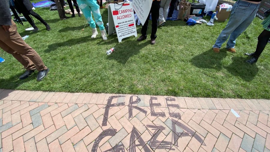 Image: "Free Gaza" can be seen written on a path at a pro-Palestinian tent encampment on the campus...