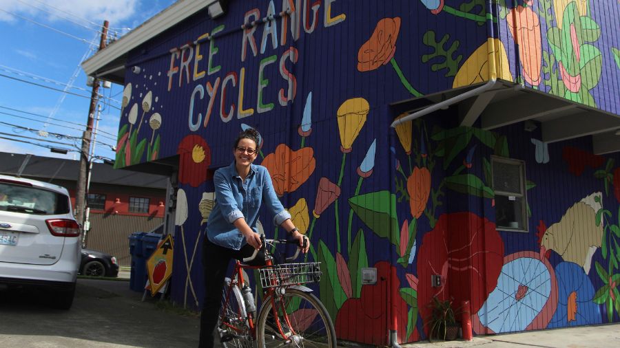 Photo: Shawna Williams, owner of Free Range Cycles, poses outside her shop on May 6, 2024, in Seatt...