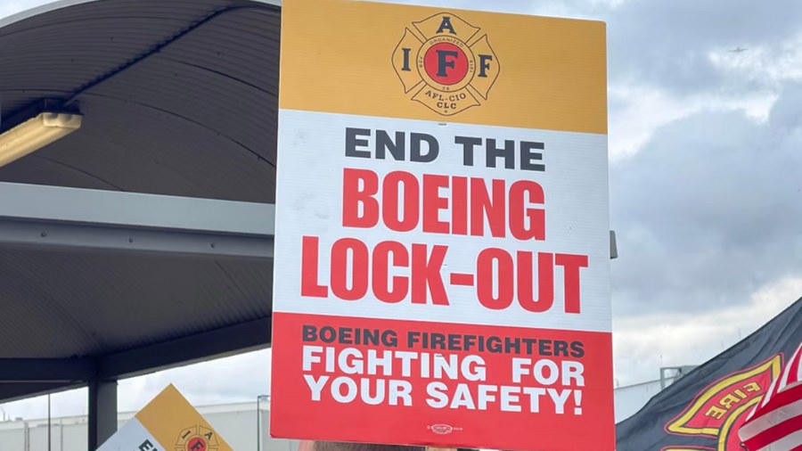 Image: A sign against the lockout of the Boeing firefighters can be seen at a one of firefighters' ...