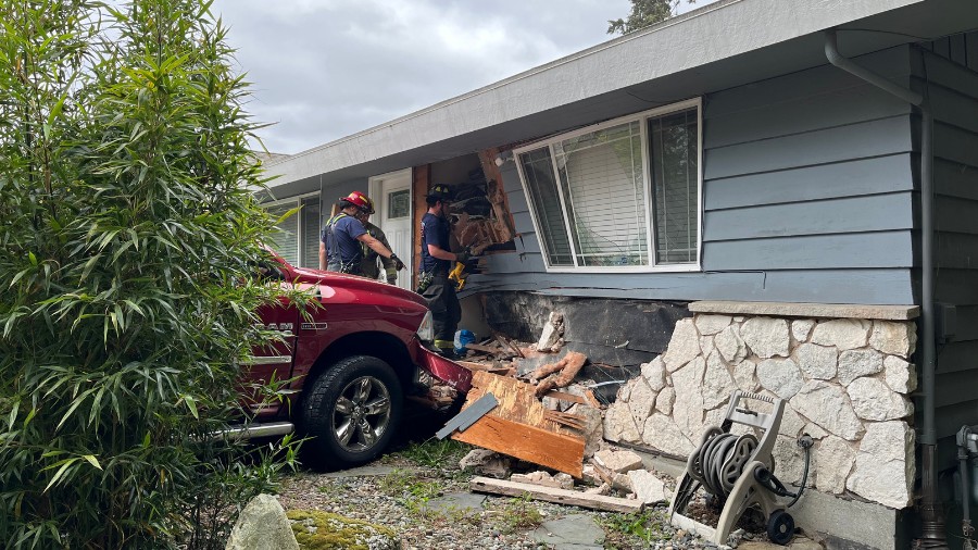 Image: A truck crashed into a home in the Esperance neighborhood of Edmonds on Thursday, May 23, 20...