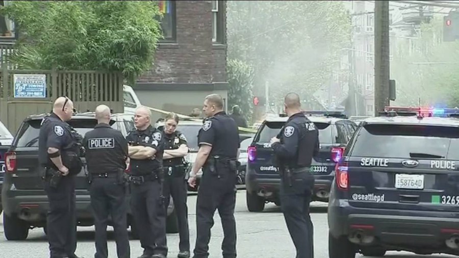 Image: Seattle police officers respond to a recent crime scene. Mayor Bruce Harrell has ordered a S...