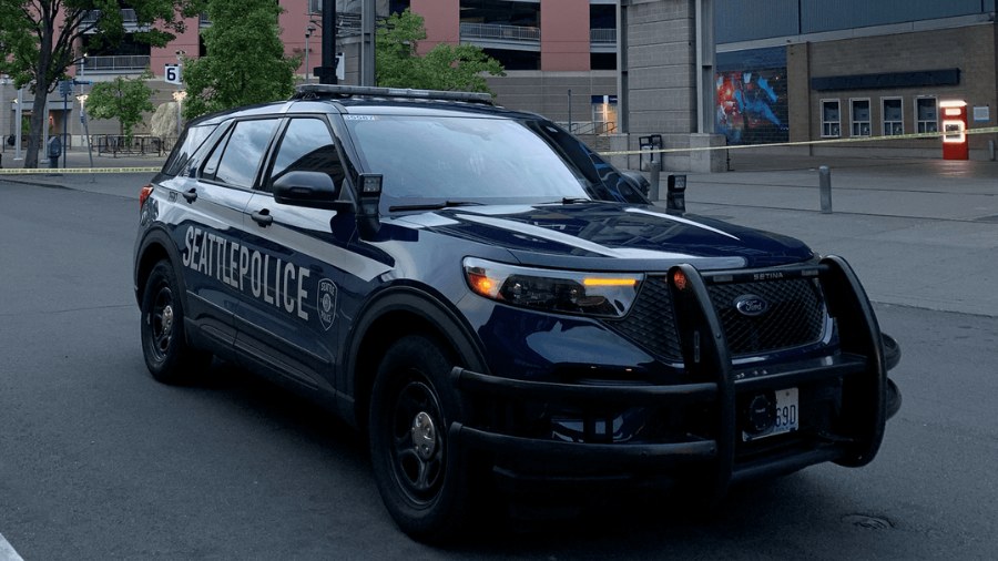 Photo: A Seattle Police Department vehicle is parked outside Lumen Field in Seattle. Officers said ...