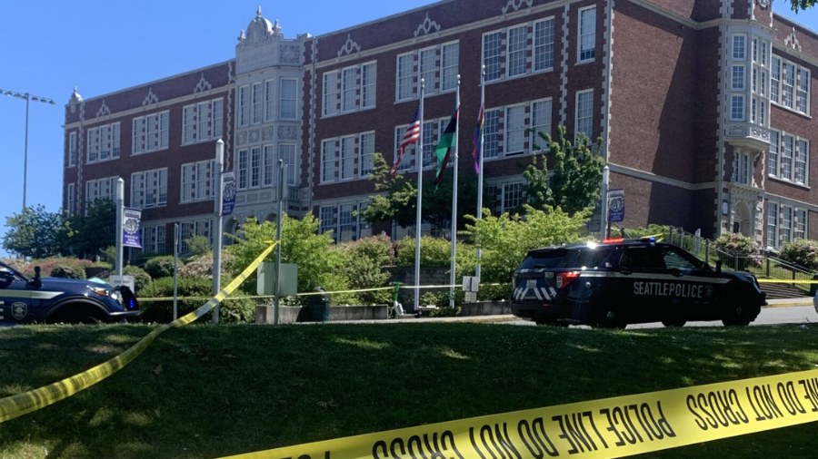 Image: A Seattle Police Department vehicle and yellow police tape can be seen outside Garfield High...