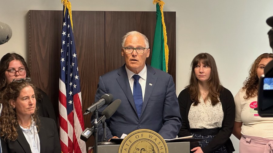 Image: Washington Gov. Jay Inslee speaks at a press conference about hospitals in the state providi...