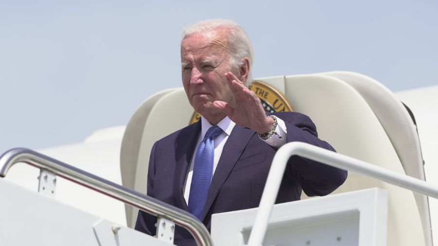 Photo: President Joe Biden disembarks Air Force One as he arrives Andrews Air Force Base, Md., Tues...