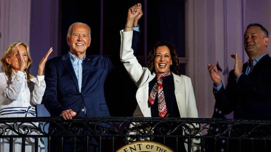 Photo: President Joe Biden and Vice President Kamala Harris join hands in the air as they view the ...