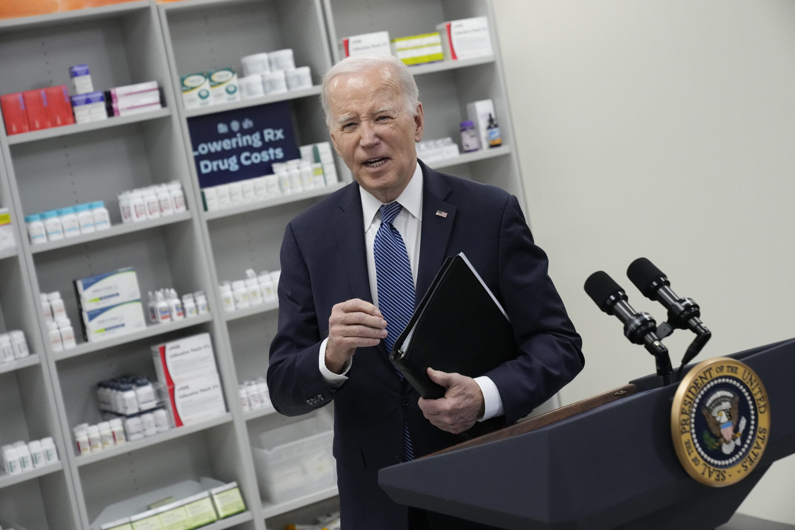 FILE - President Joe Biden leaves after speaking about prescription drug costs at the National Inst...