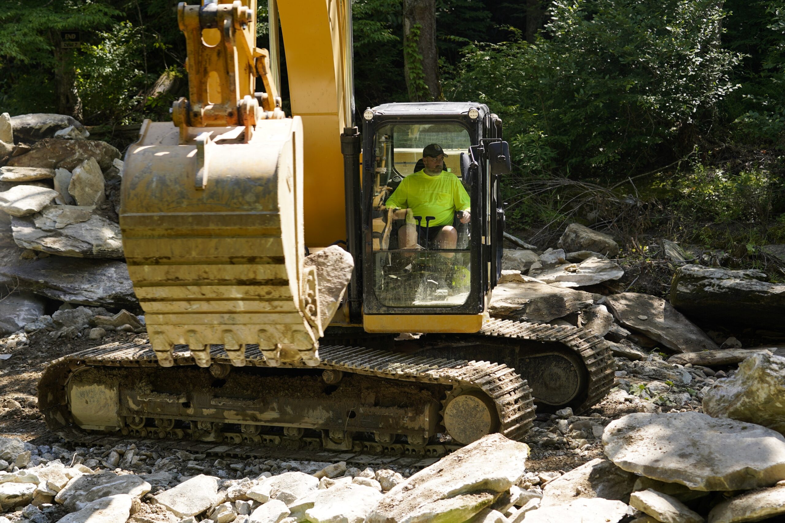 A crew member works on the removal of the Shulls Mill Dam on the Watauga River, near Boone, N.C., M...