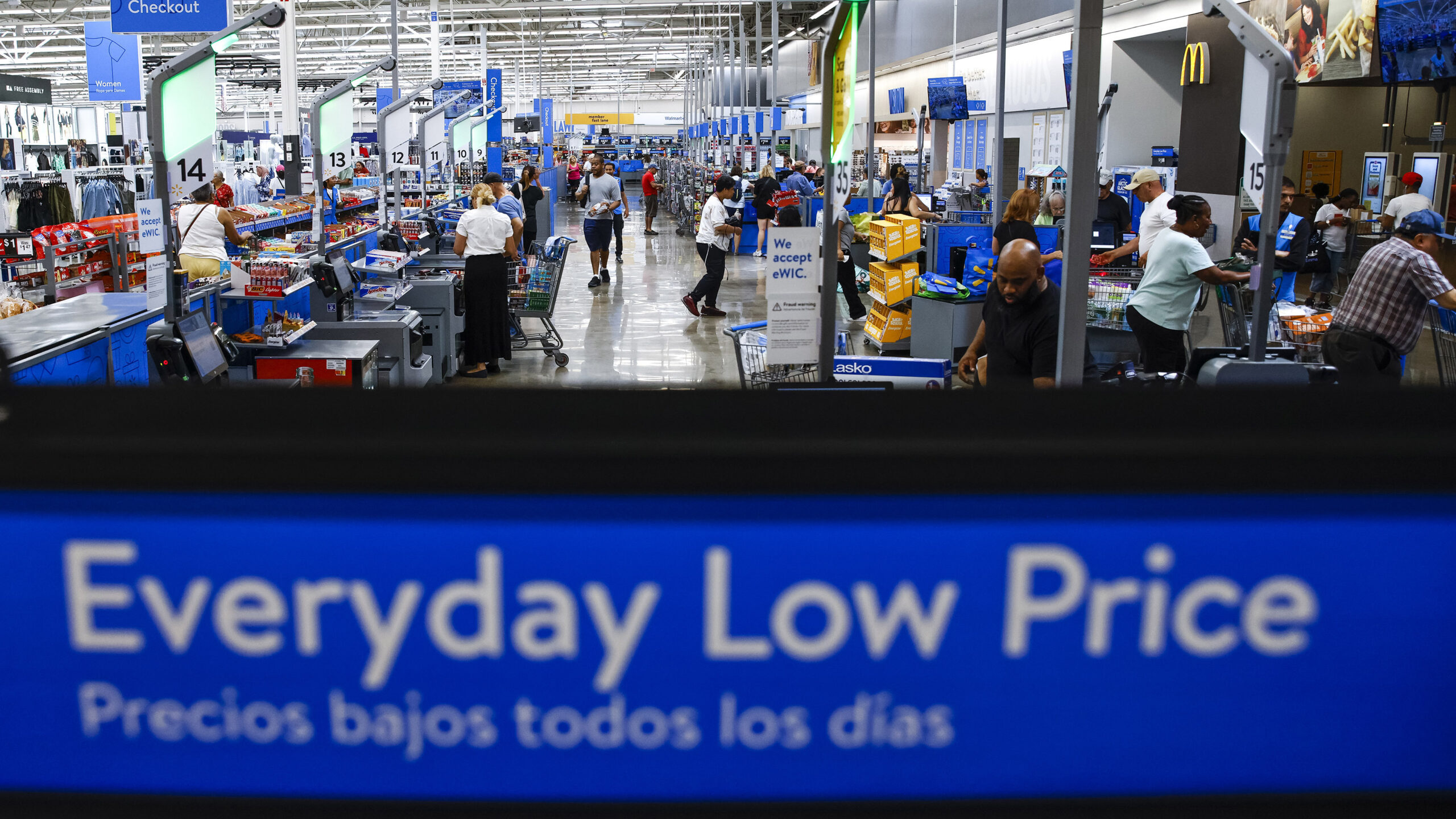 FILE - Customers use self check out at a Walmart Superstore in Secaucus, New Jersey, July 11, 2024....