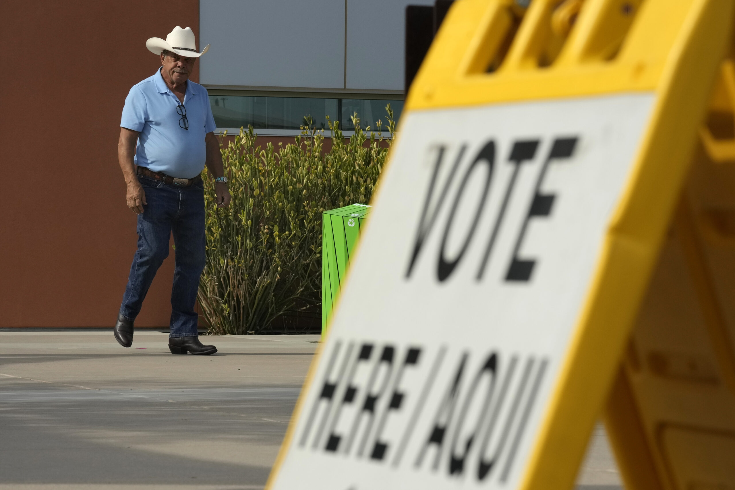 A voter leaves a precinct after casting their ballot in the state's primary election, Tuesday, July...