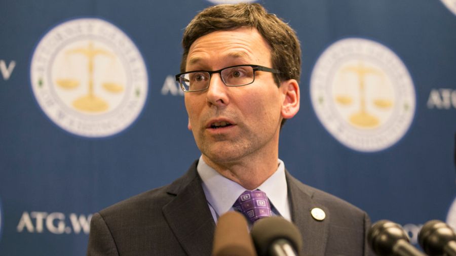 Photo: Washington Attorney General Bob Ferguson speaks during a media conference....