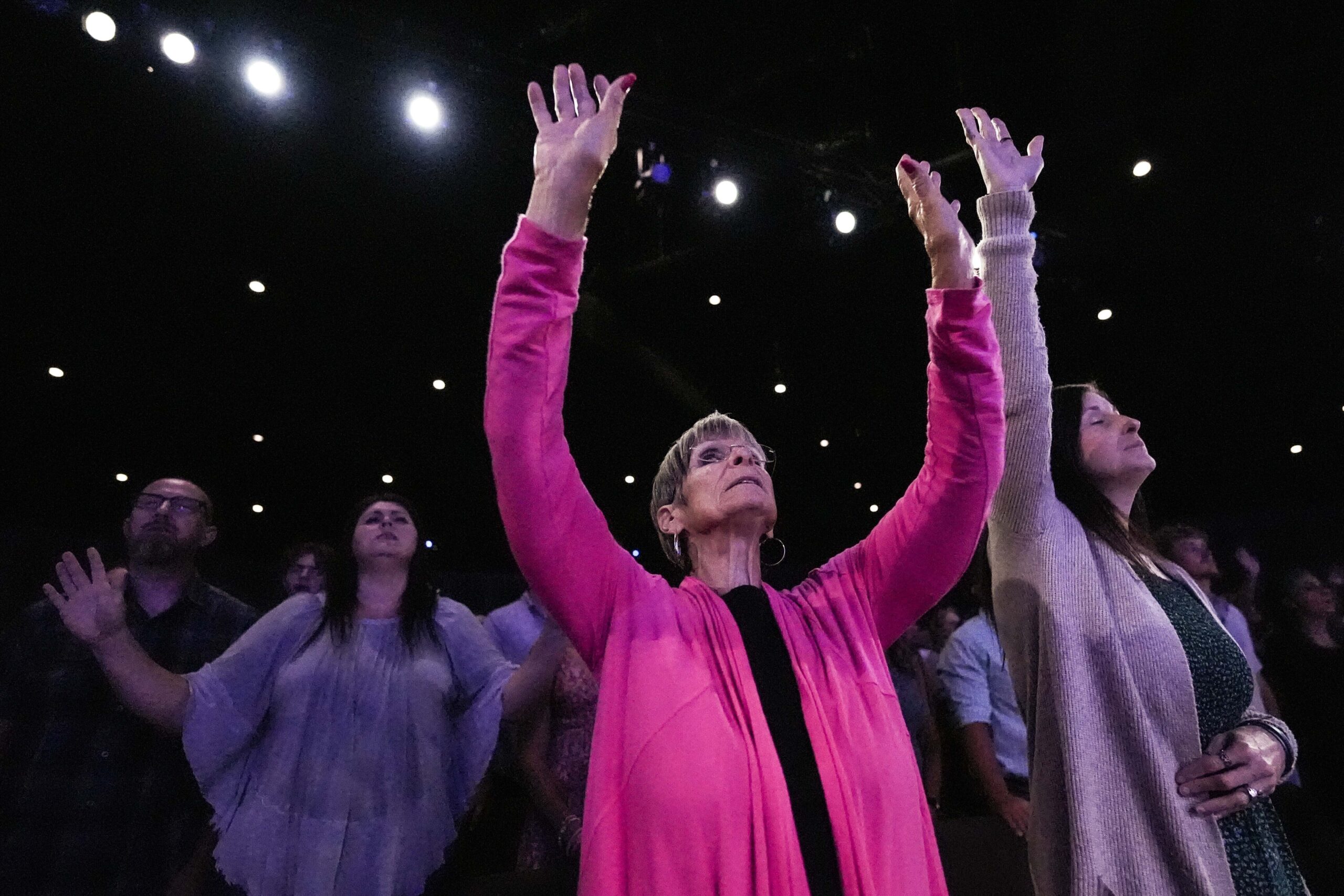 A member prays during a Sunday service at Bethlehem Church, Sunday, Sept. 8, 2024, in Bethlehem, Ga...