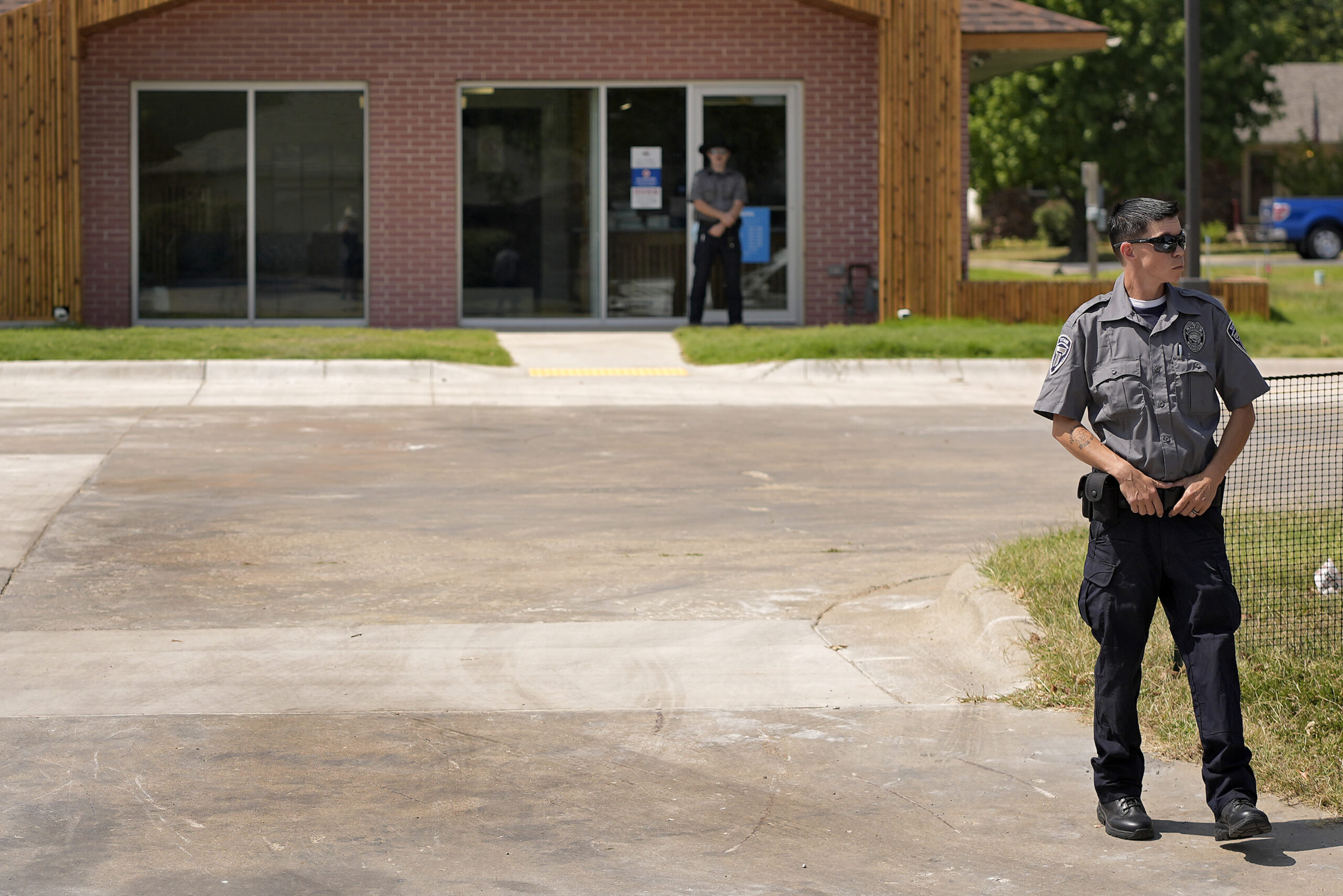 Security personnel stand outside a recently opened Planned Parenthood clinic, Tuesday, Sept. 10, 20...