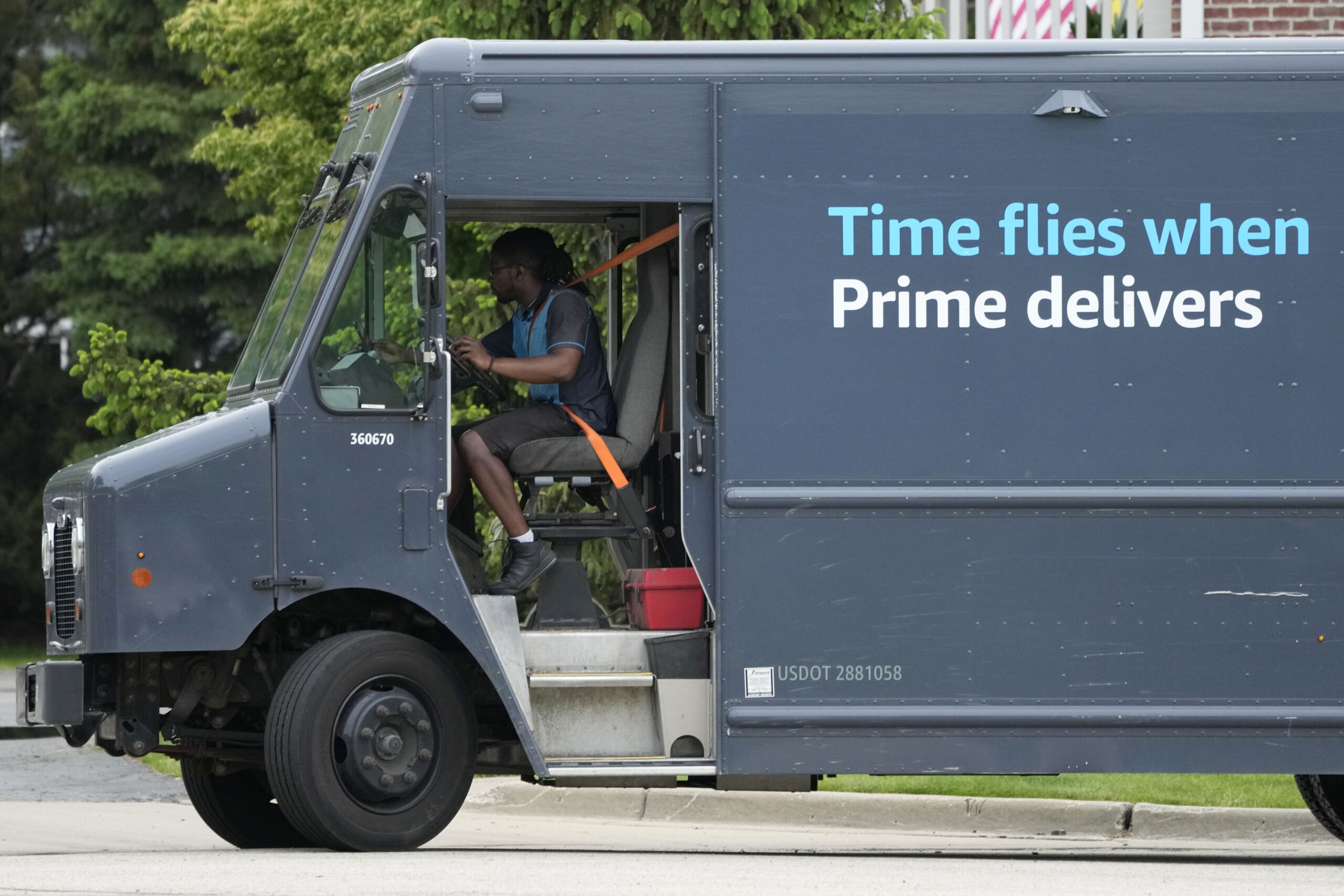 FILE - An Amazon truck makes deliveries in Wheeling, Ill., May 16, 2024. (AP Photo/Nam Y. Huh, File...