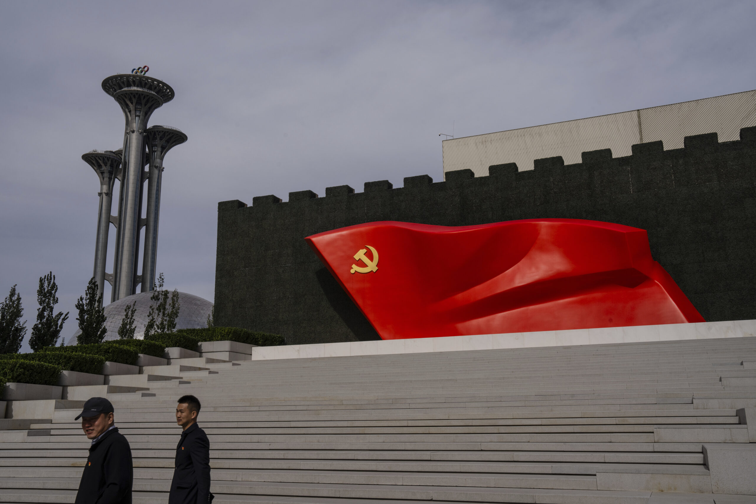 FILE - Visitors pass the Chinese Communist Party flag at the museum of the Communist Party of China...