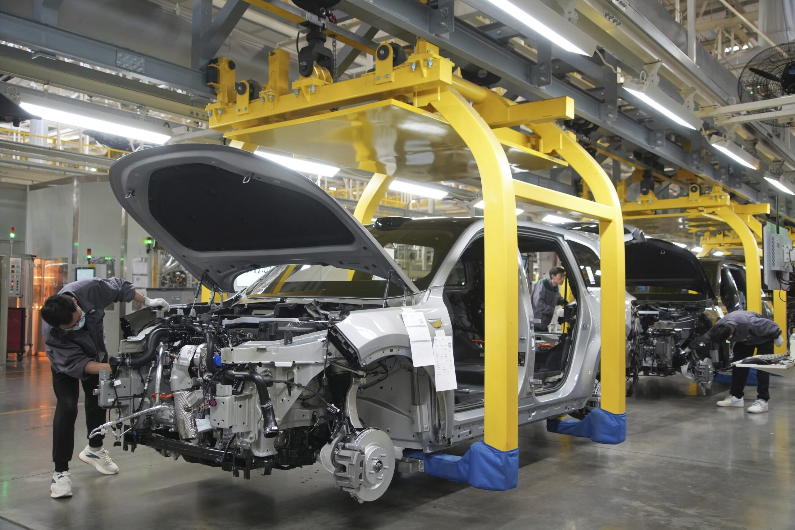 FILE - A worker assembles an SUV at a car plant of Li Auto, a major Chinese EV maker, in Changzhou ...