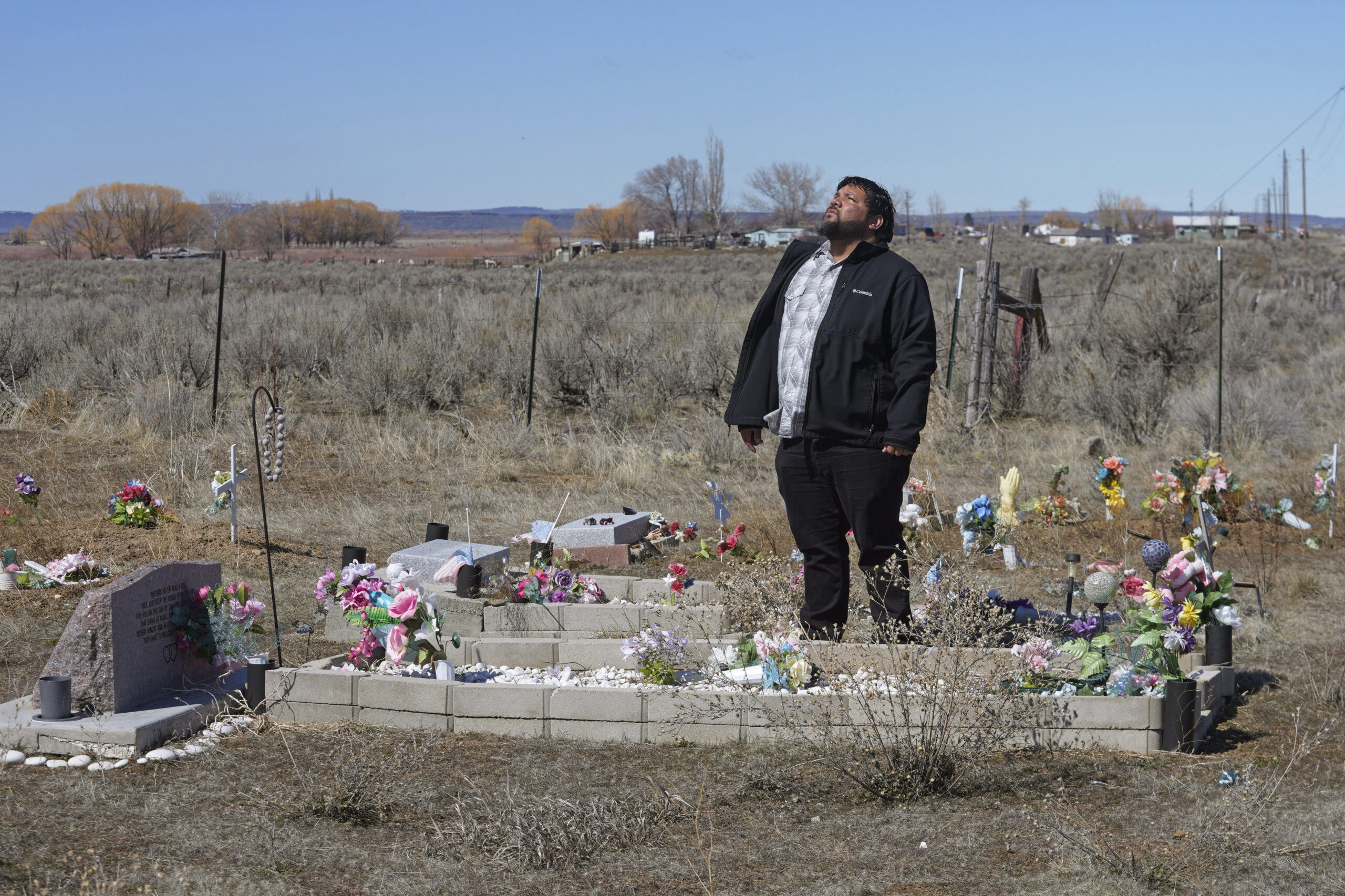 Shoshone-Paiute tribal member Michael Hanchor visits his mother’s grave, March 15, 2024, in Owyhe...