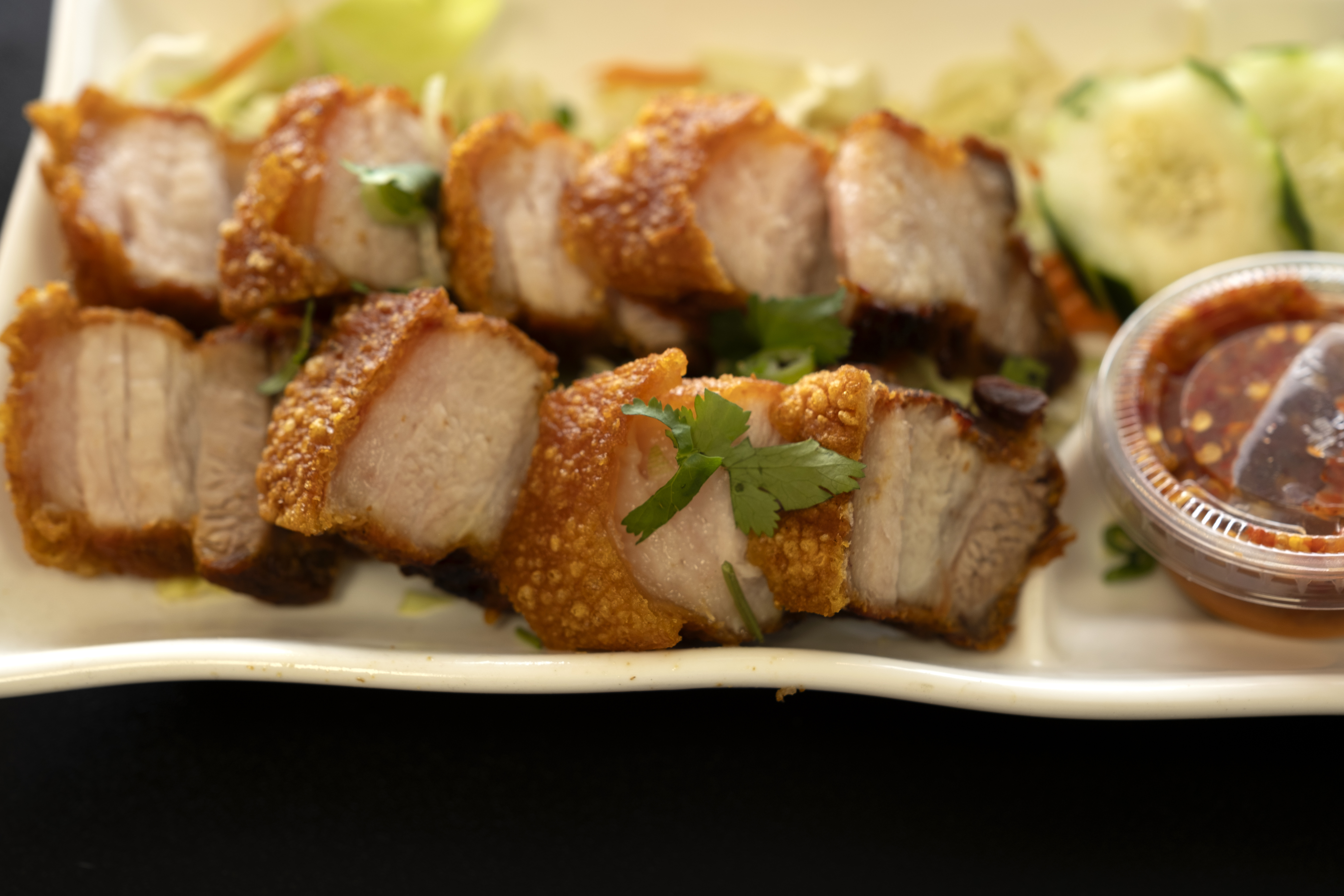 FILE - Crispy Pork Belly is presented at "Love & Thai" restaurant in Fresno, Calif., Wednesday, Dec...