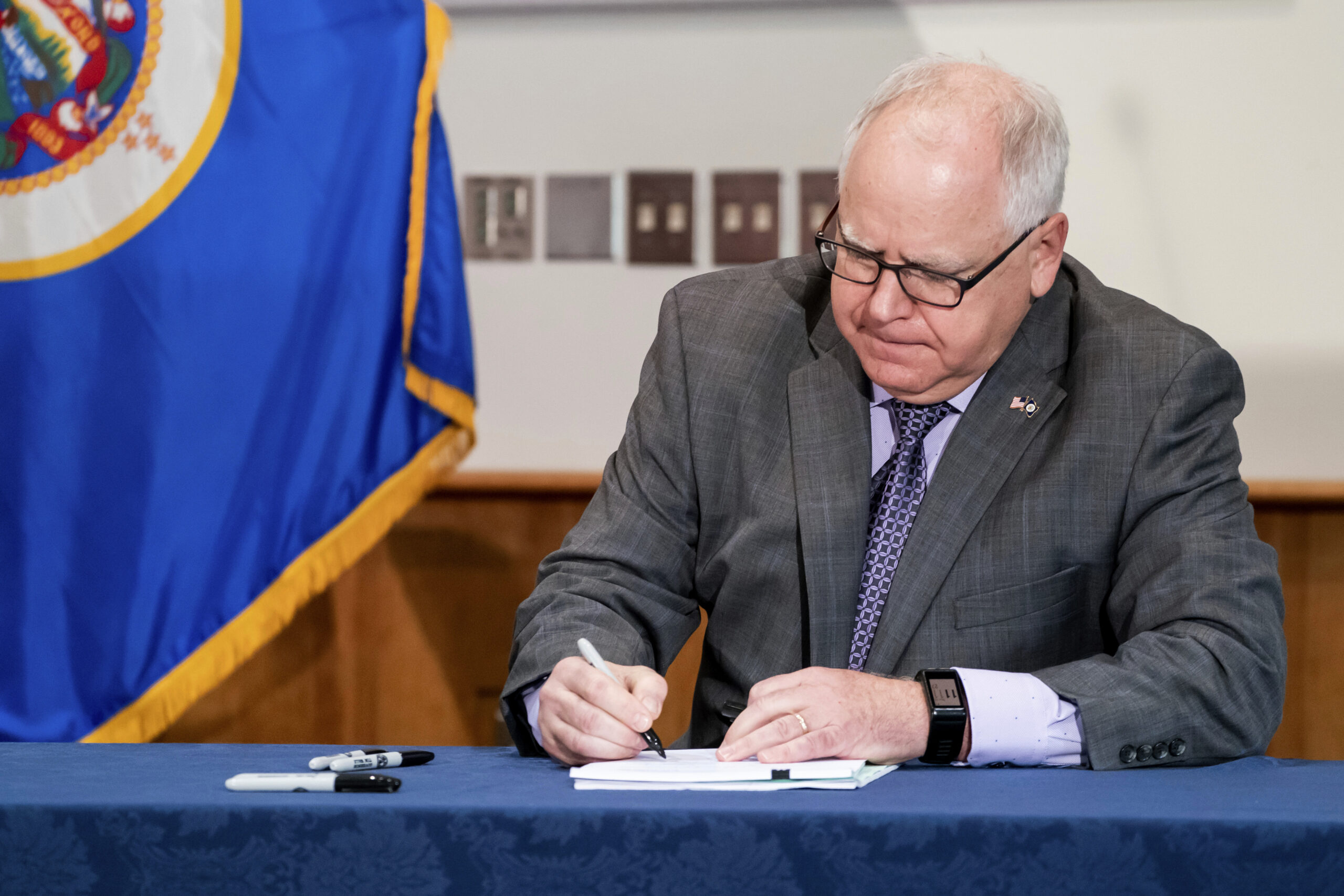 FILE - Gov. Tim Walz signs into law a sweeping package of police accountability measures in St. Pau...