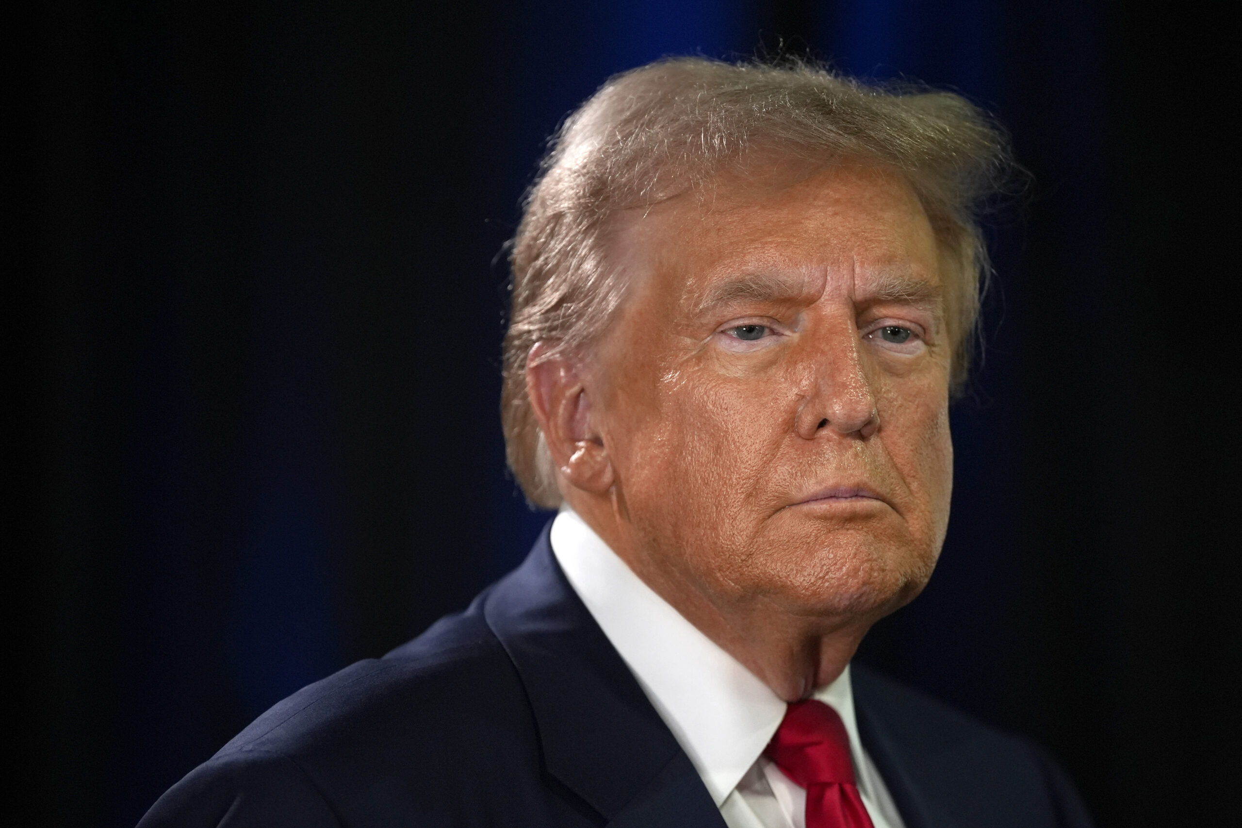 Republican presidential nominee former President Donald Trump speaks to reporters in the spin room ...