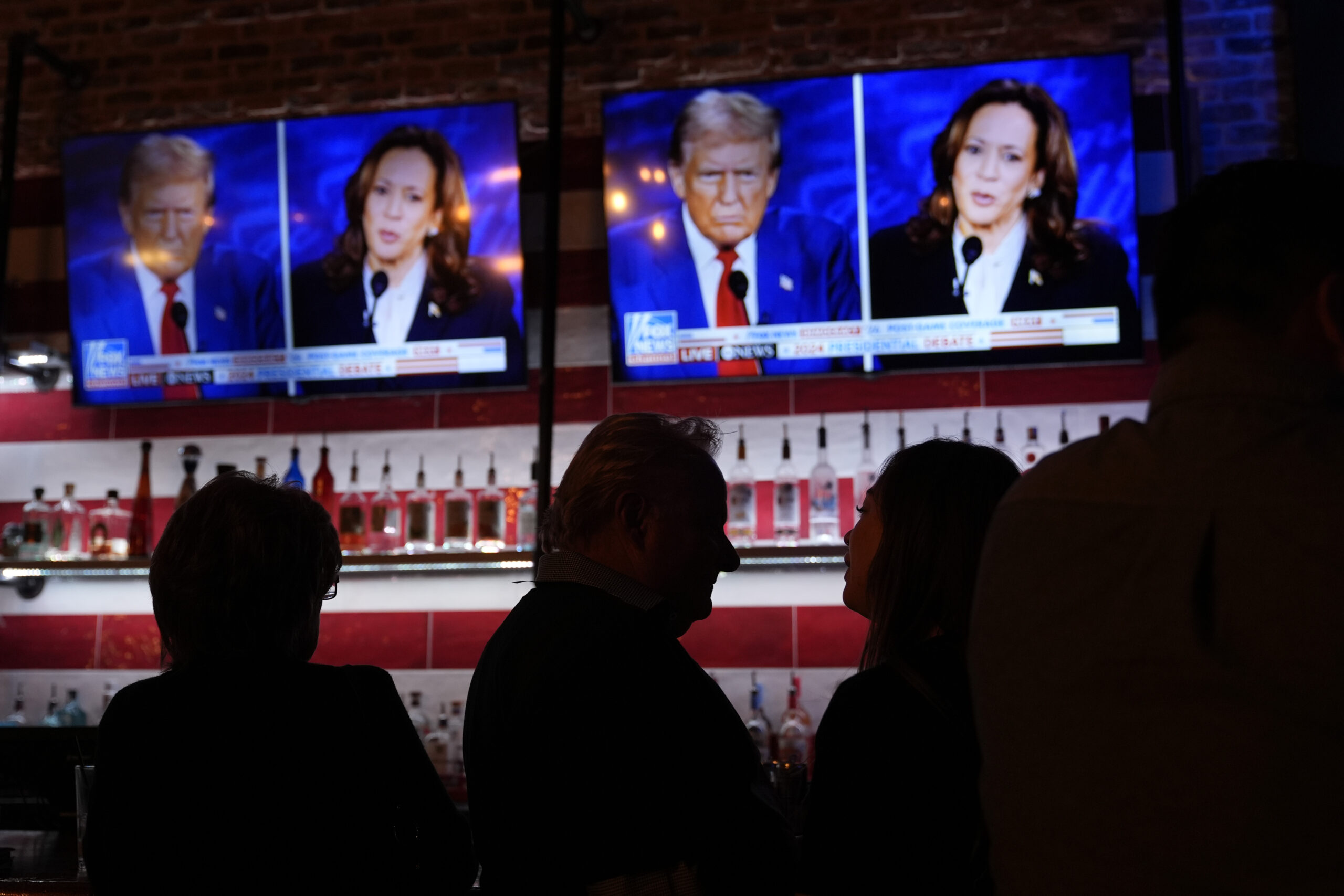 Viewers gather to watch a debate between Democratic presidential nominee Vice President Kamala Harr...