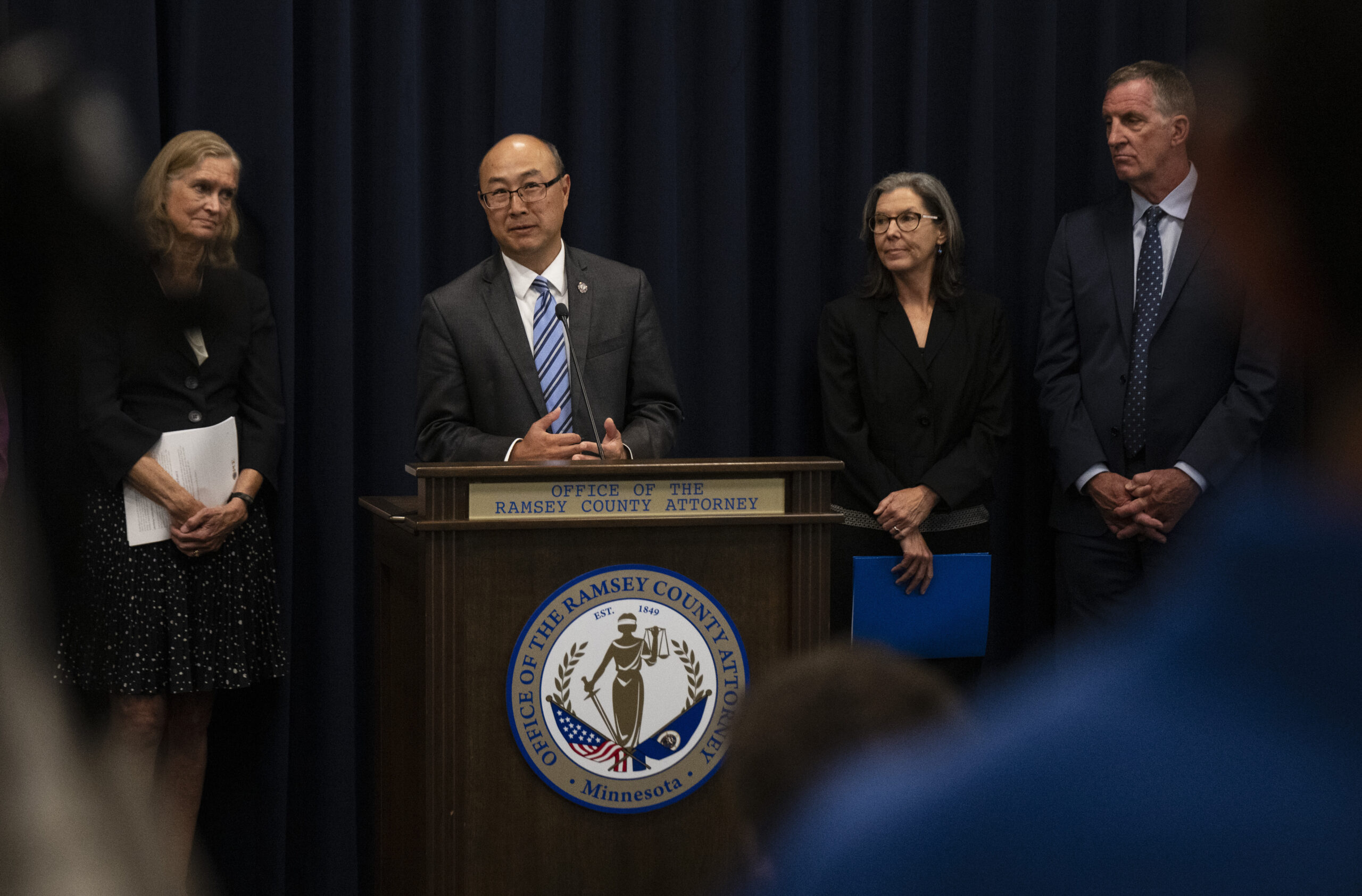 Ramsey County Attorney John Choi, at podium, discusses his office's review of former Ramsey County ...