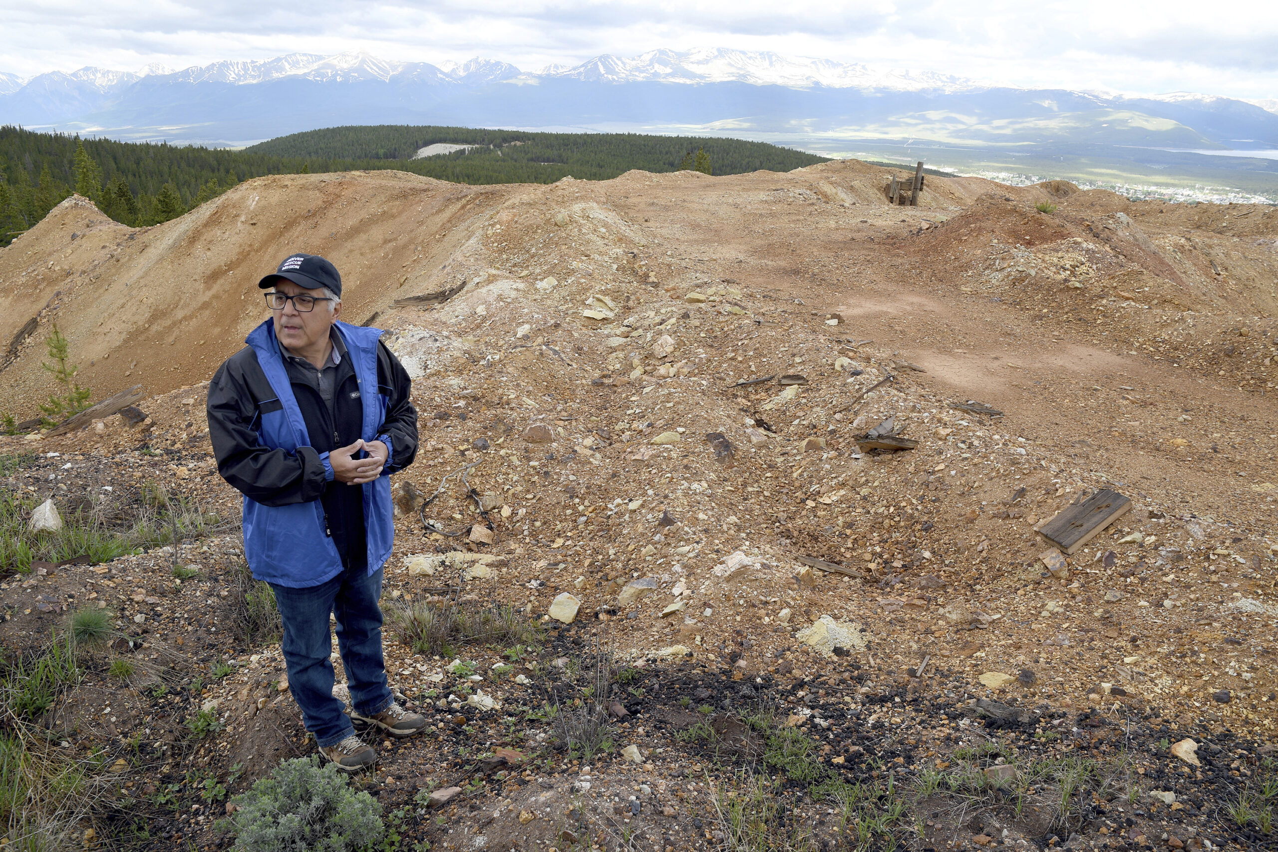 Nick Michael with CJK Milling stands on top of discarded piles of ore in Leadville, Colo. on Thursd...