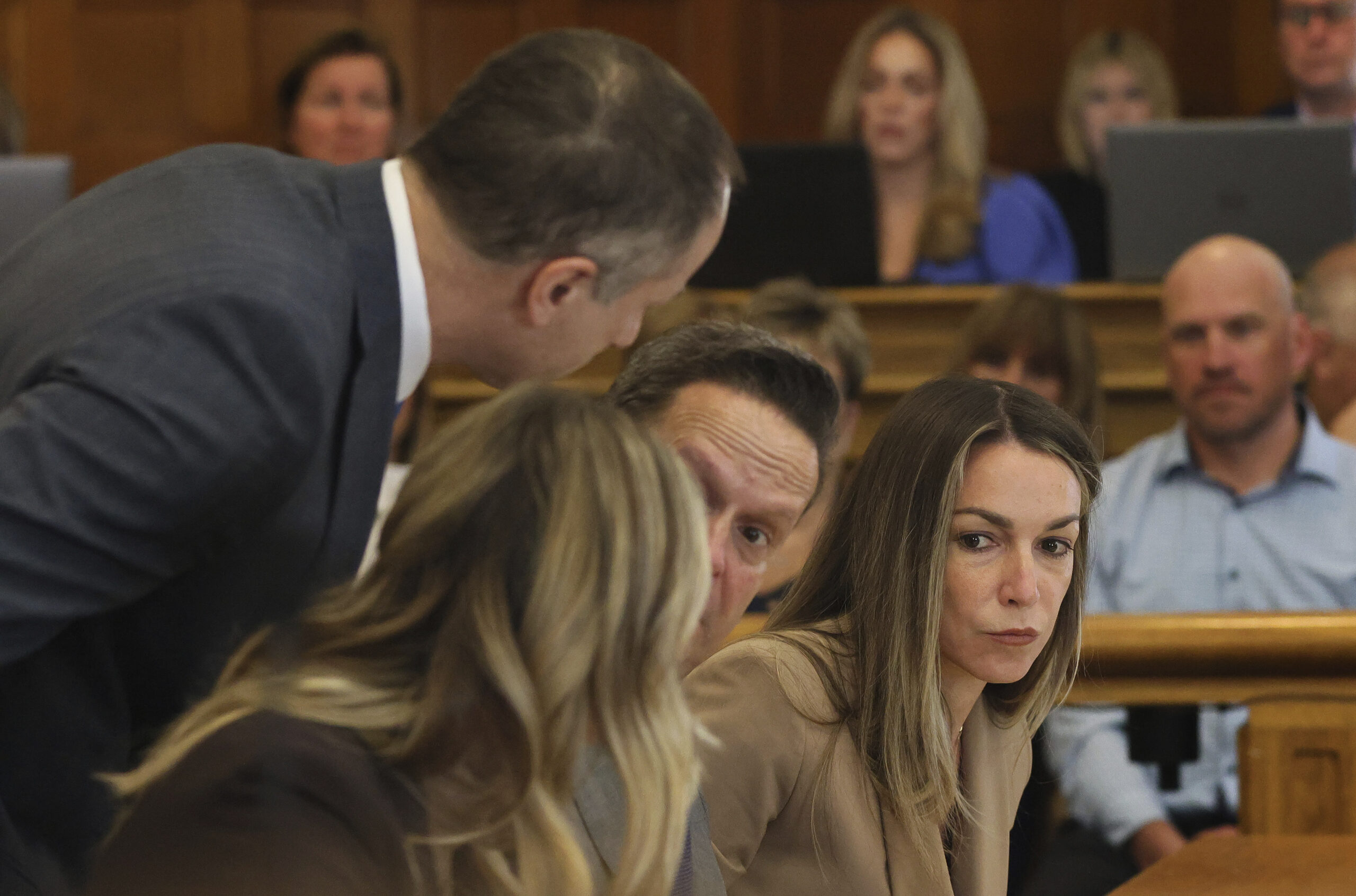 FILE - Karen Read sits at the defense table with her attorneys during her murder trail at Dedham Su...