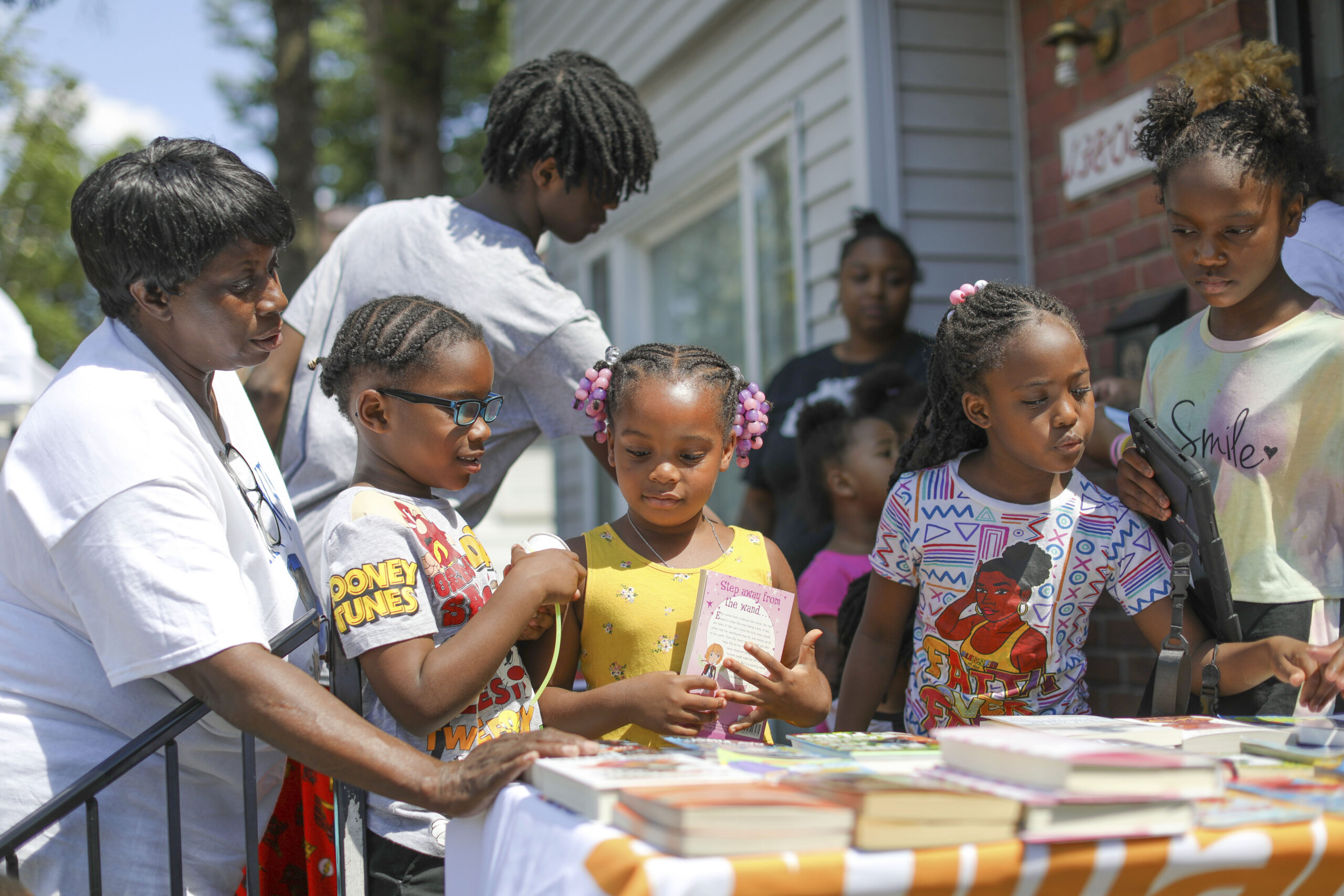 Children take part in Brilliant Detroit's "Street Read" program, where they get to select a book to...