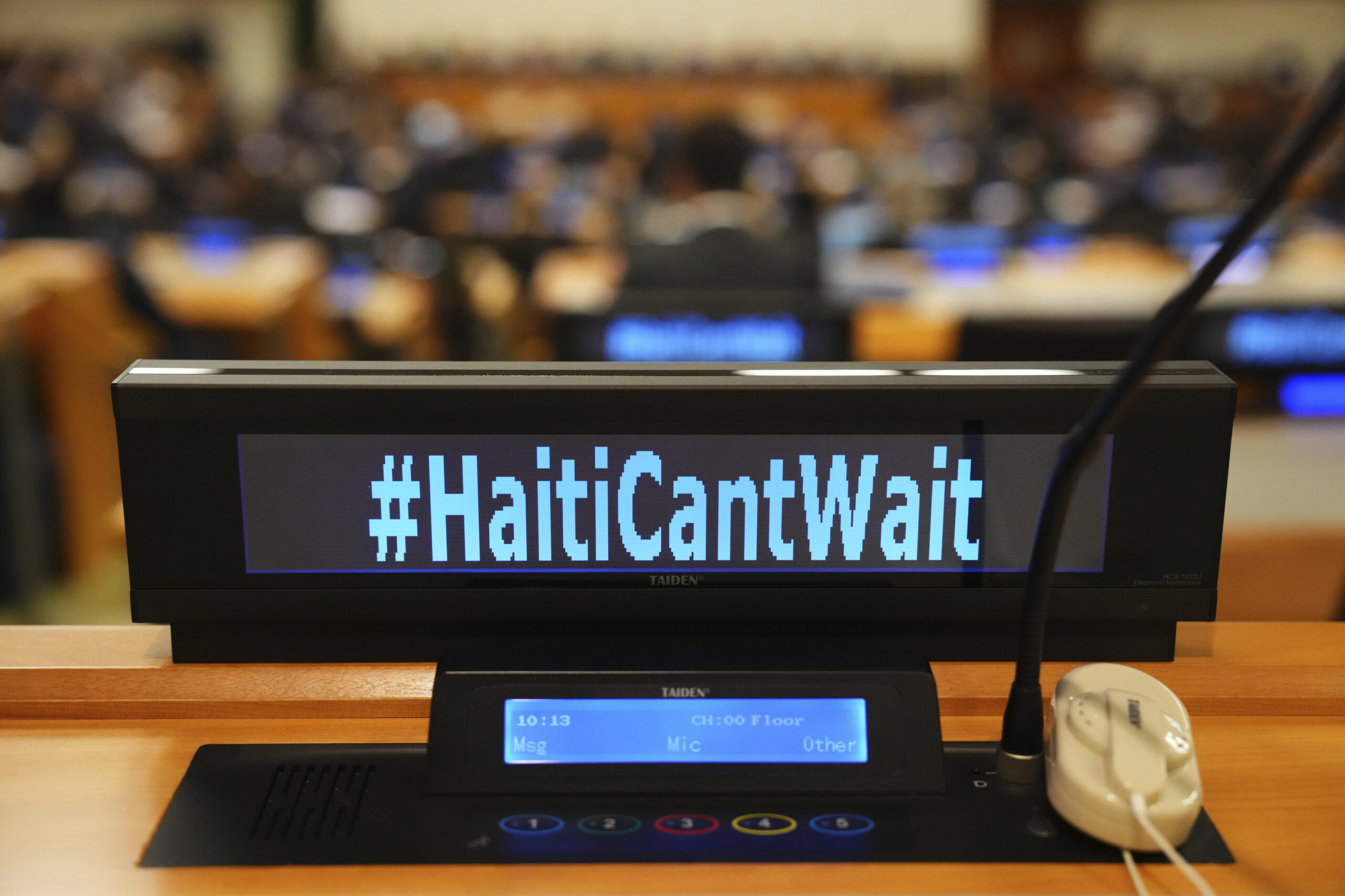 The social media slogan #HaitiCantWait is displayed as Canada Prime Minister Justin Trudeau takes p...